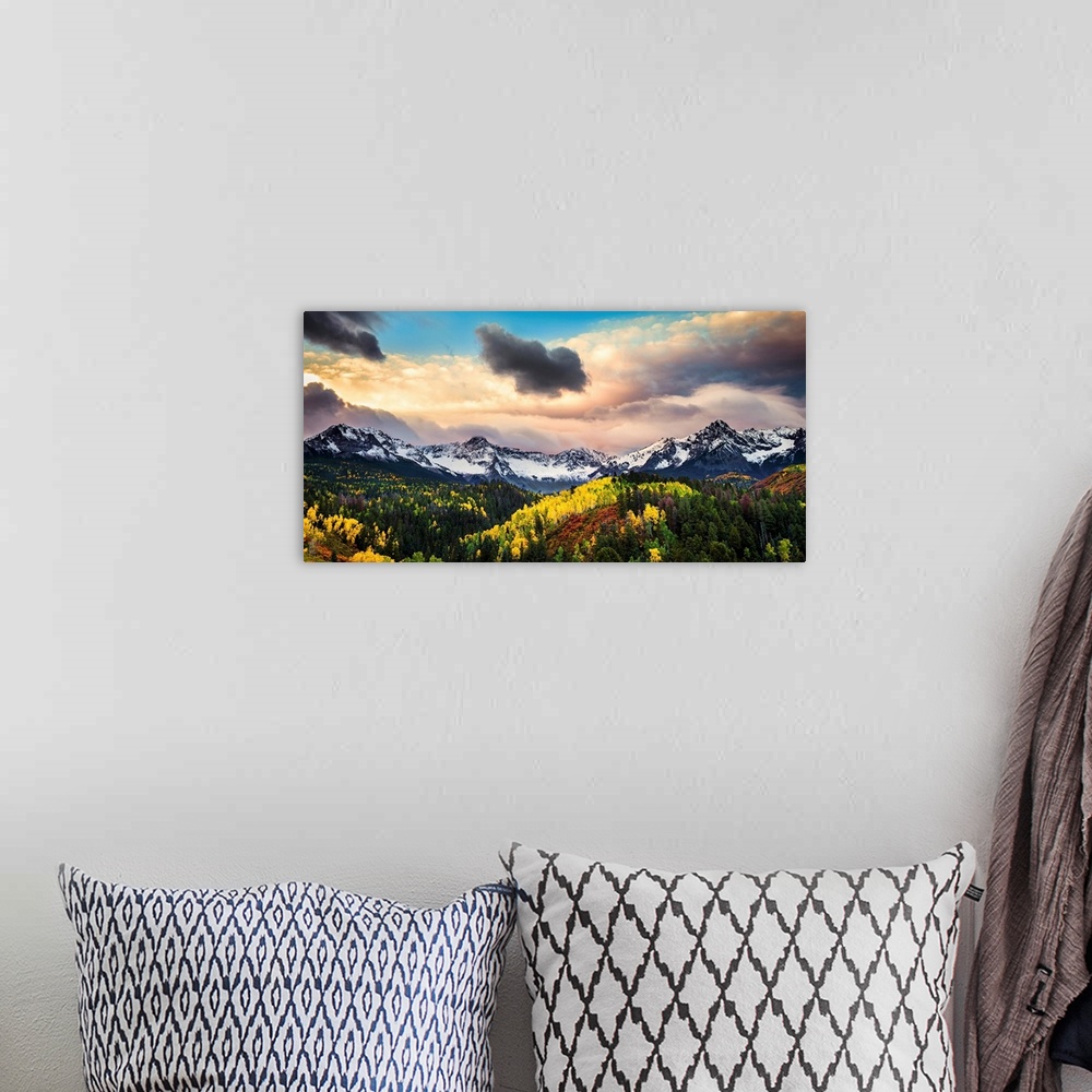 A bohemian room featuring Photograph of the sun about to break through the clouds over the mountains and forests of Colorad...