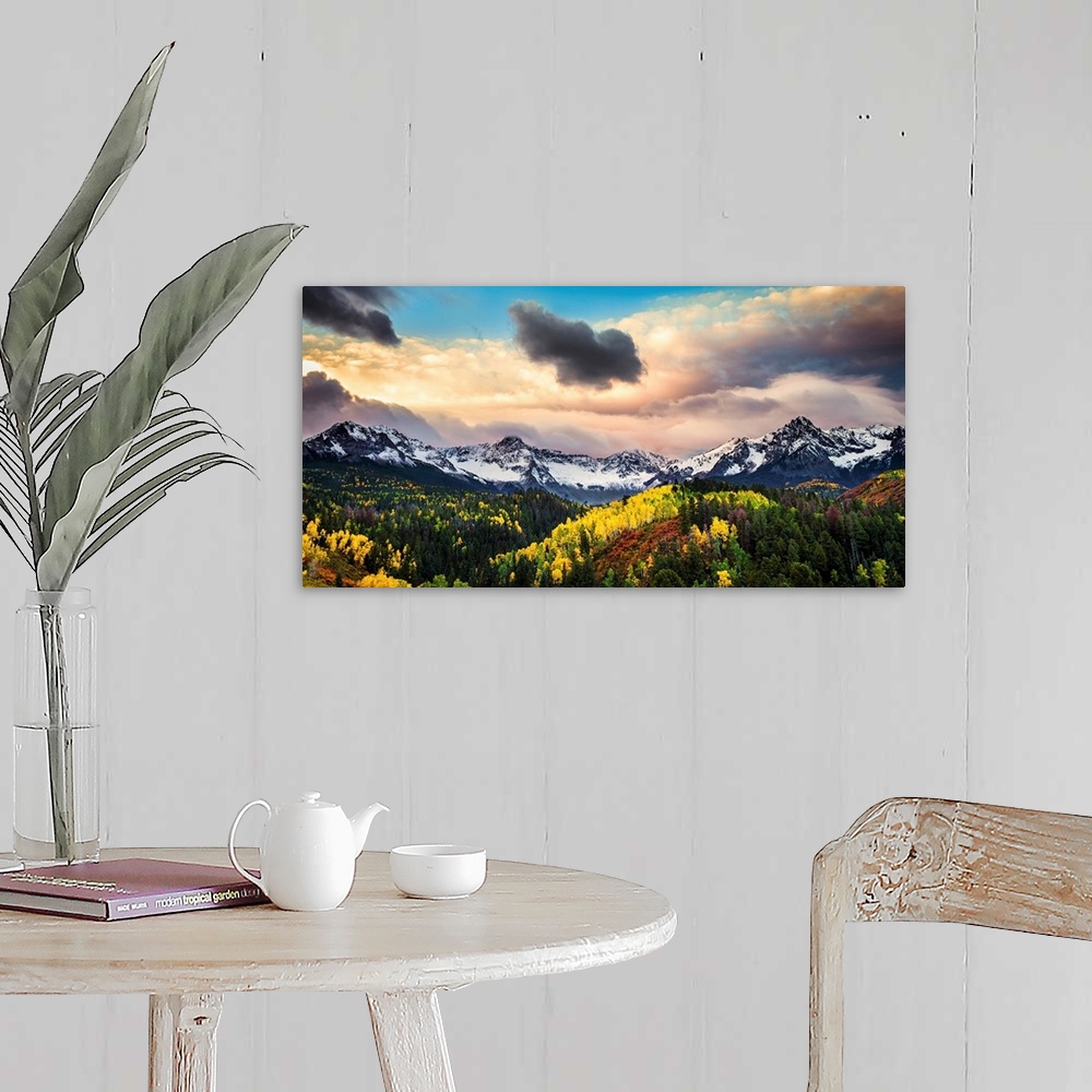 A farmhouse room featuring Photograph of the sun about to break through the clouds over the mountains and forests of Colorad...