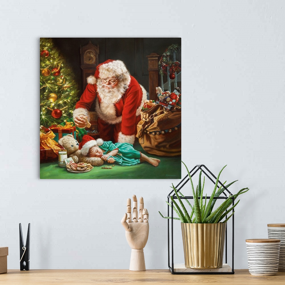 A bohemian room featuring Santa taking a cookie by sleeping little girl.