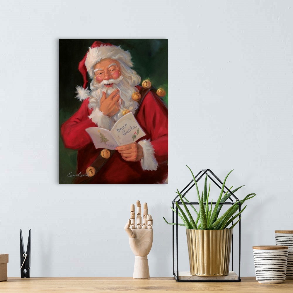 A bohemian room featuring Painting of Santa Claus smiling while reading a note.