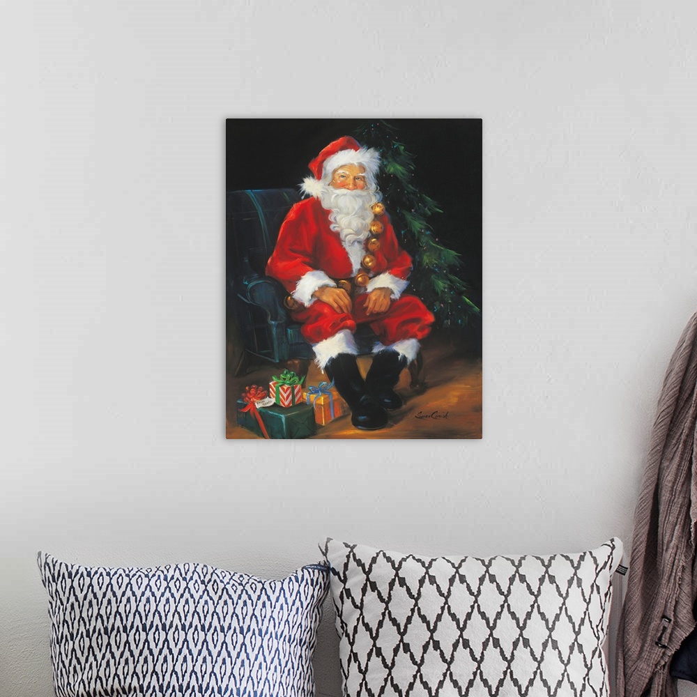 A bohemian room featuring Portrait of Santa Claus sitting by a tree with presents.