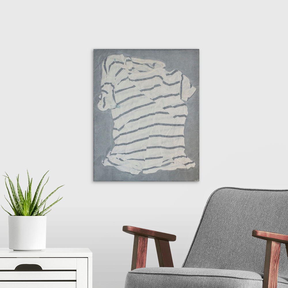 A modern room featuring A striped, torn and mended t-shirt suspended in handmade paper.