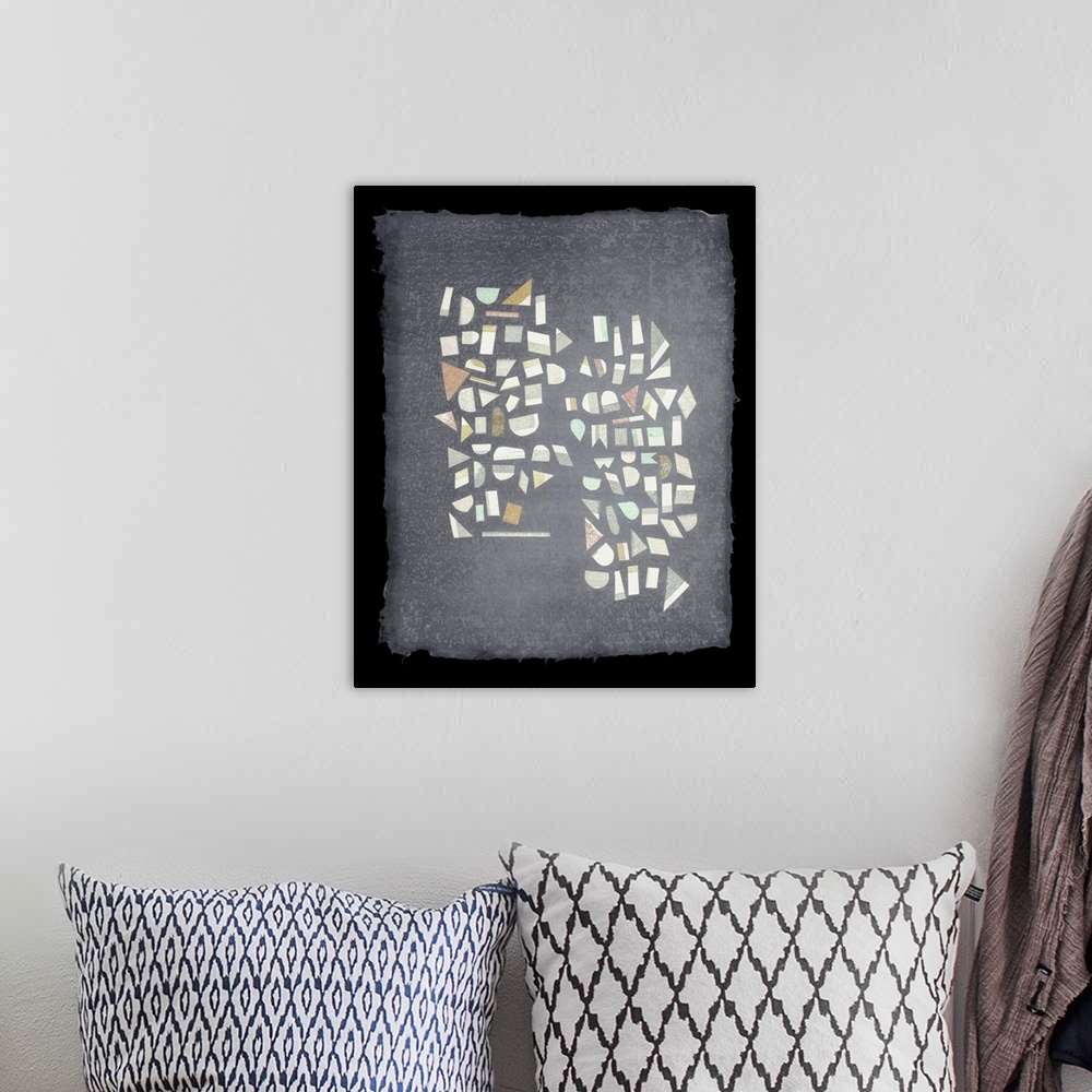 A bohemian room featuring Two columns of text-like geometric shapes dance on a page of handmade paper.