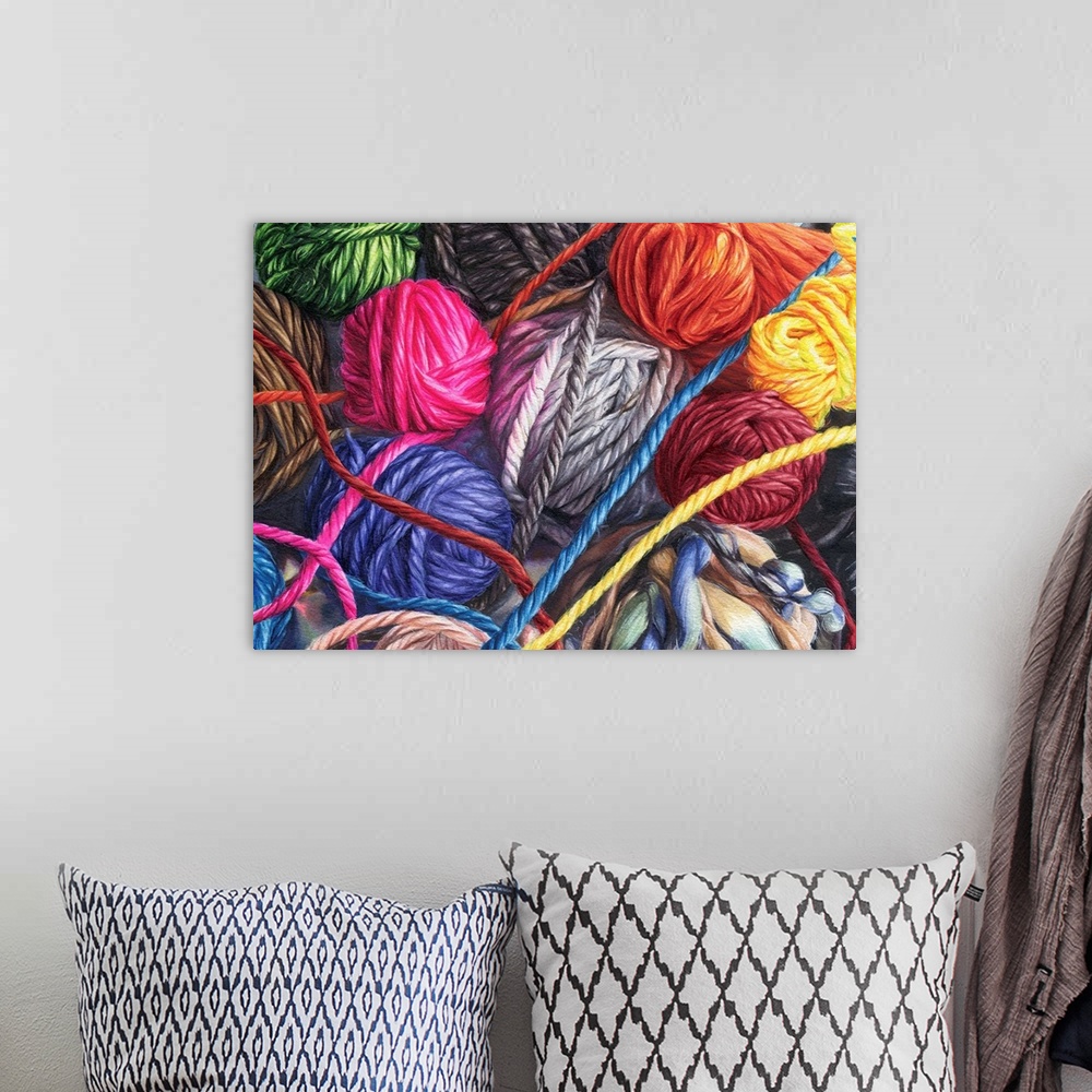 A bohemian room featuring A horizontal watercolor of a bunch of balls of yarn in a variety of colors.