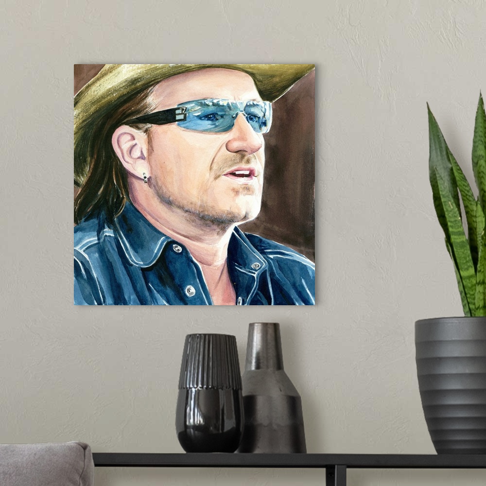 A modern room featuring Summertime Bono sees something in the middle-distance.