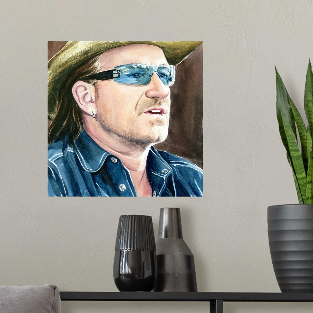 A modern room featuring Summertime Bono sees something in the middle-distance.