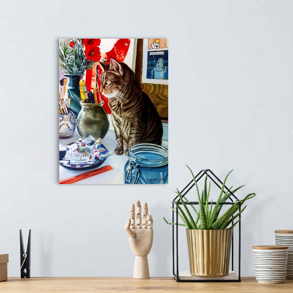 A bohemian room featuring A vertical watercolor painting of a cat sitting on a table in an artist studio.