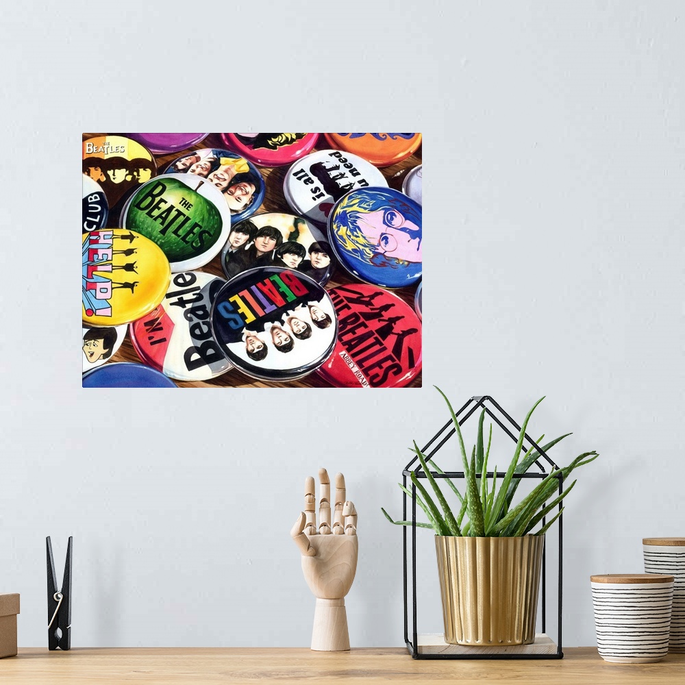 A bohemian room featuring Watercolor painting of a collection of Beatles pins/buttons/badges on a wooden table.