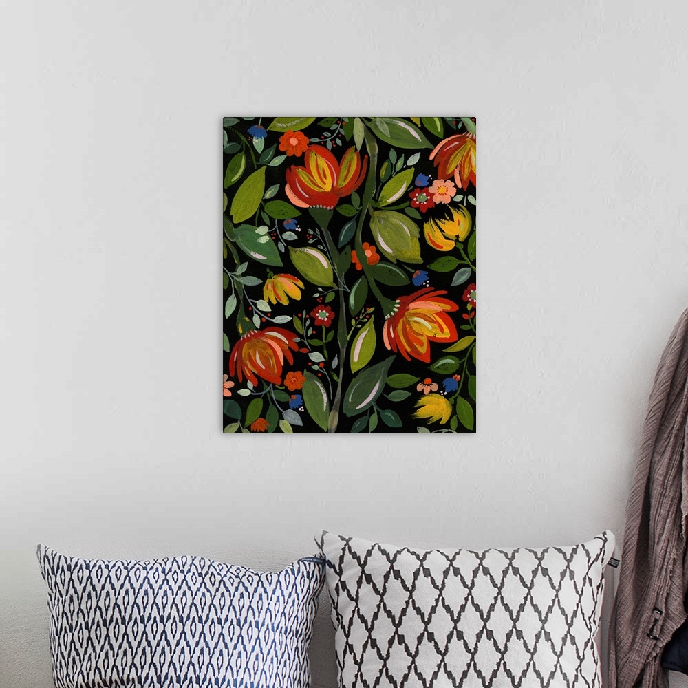 A bohemian room featuring Painting of warm-colored flowers and green leaves against a black background