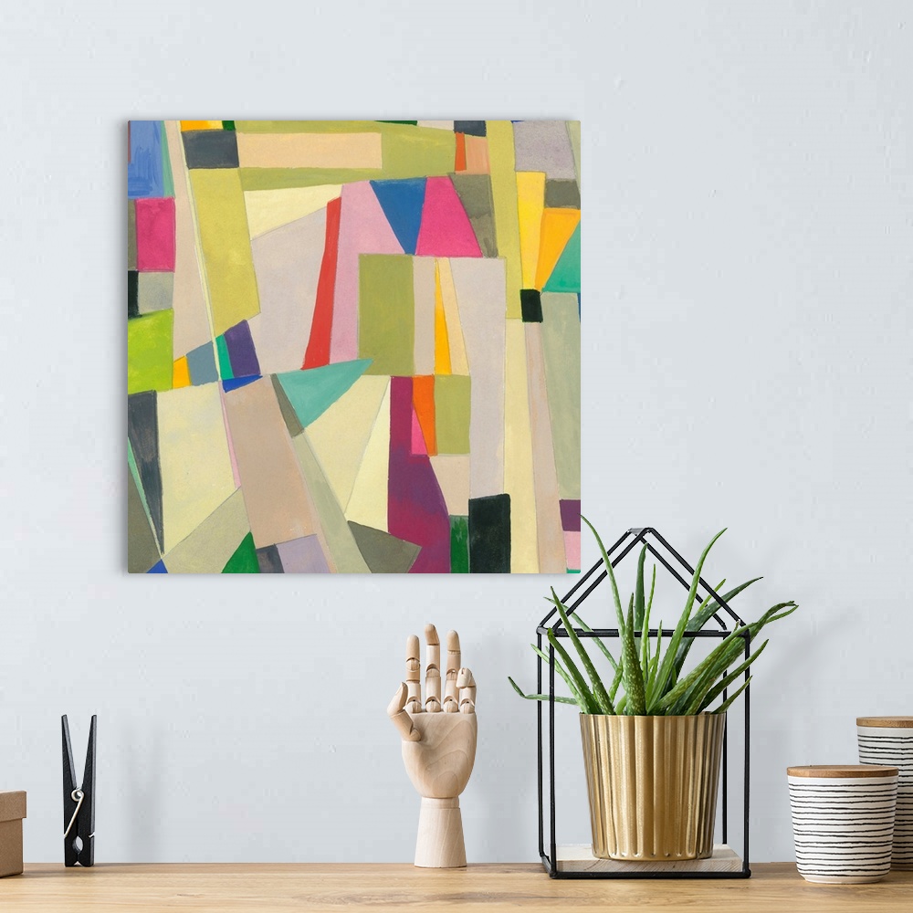 A bohemian room featuring One painting in a series of geometric abstracts with some subdued colors depicting the artist's i...