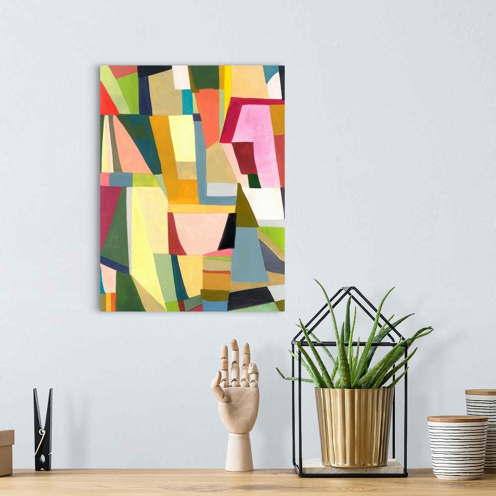 A bohemian room featuring One painting in a series of geometric abstracts with soothing shades of pink and green depicting ...