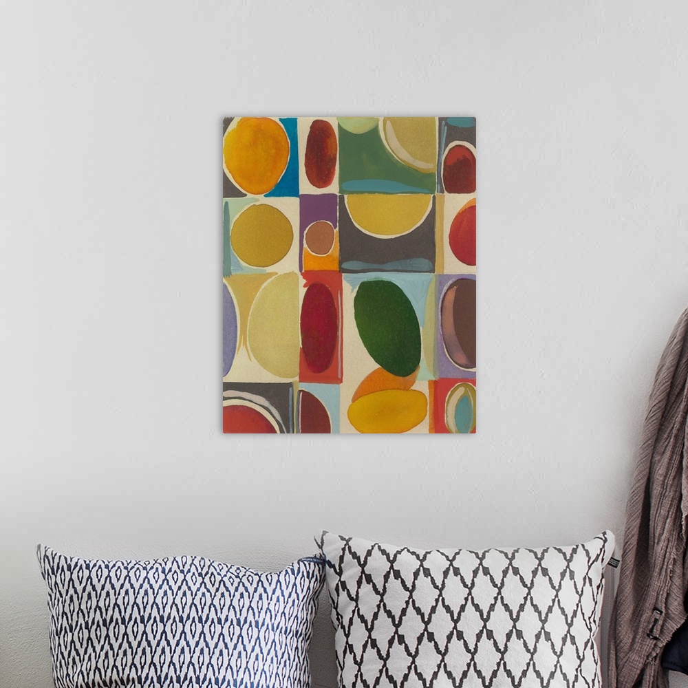 A bohemian room featuring Painting of oval shapes in various hues and sizes over blocks of color.