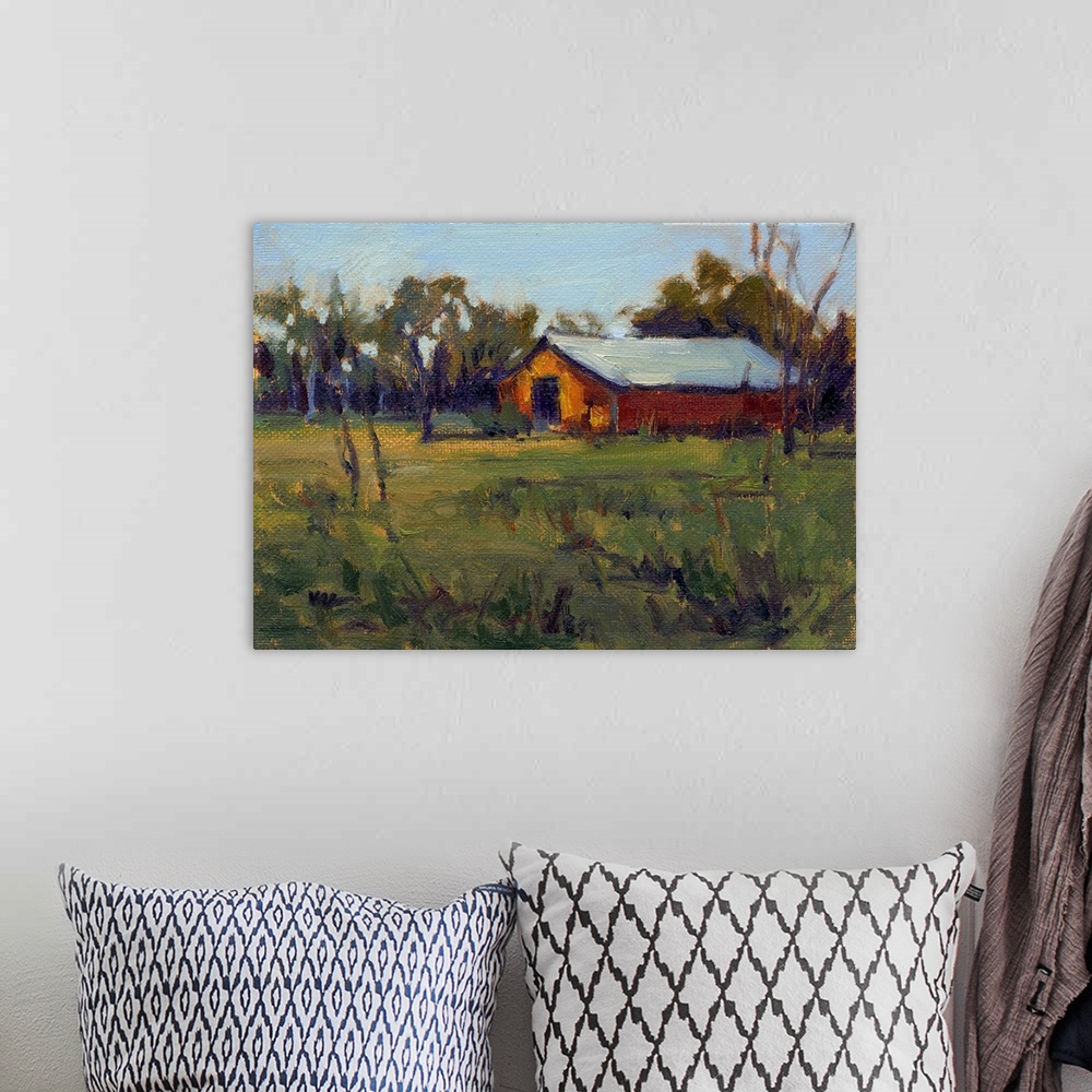 A bohemian room featuring A horizontal contemporary painting of a barn near trees with a field in the foreground.