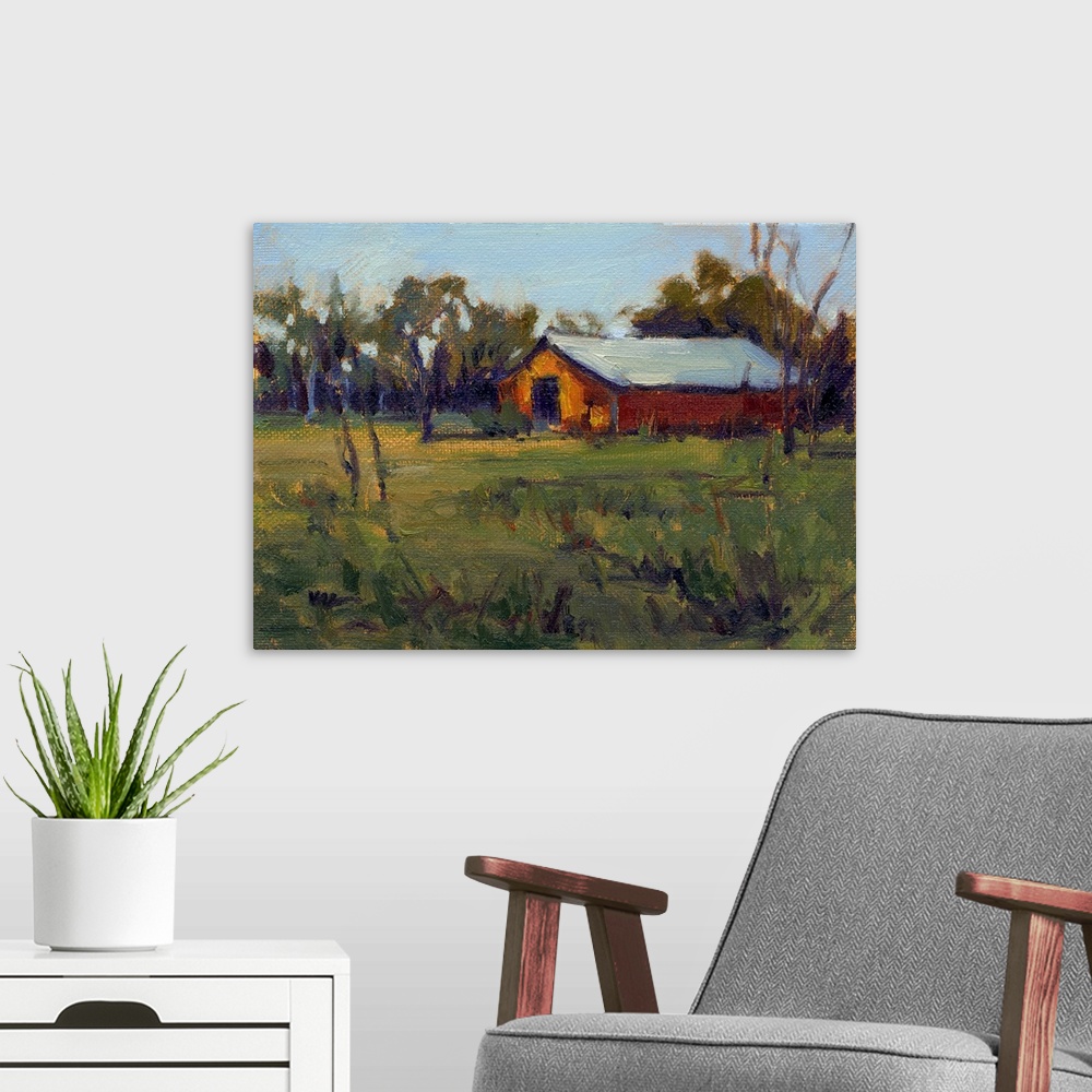 A modern room featuring A horizontal contemporary painting of a barn near trees with a field in the foreground.
