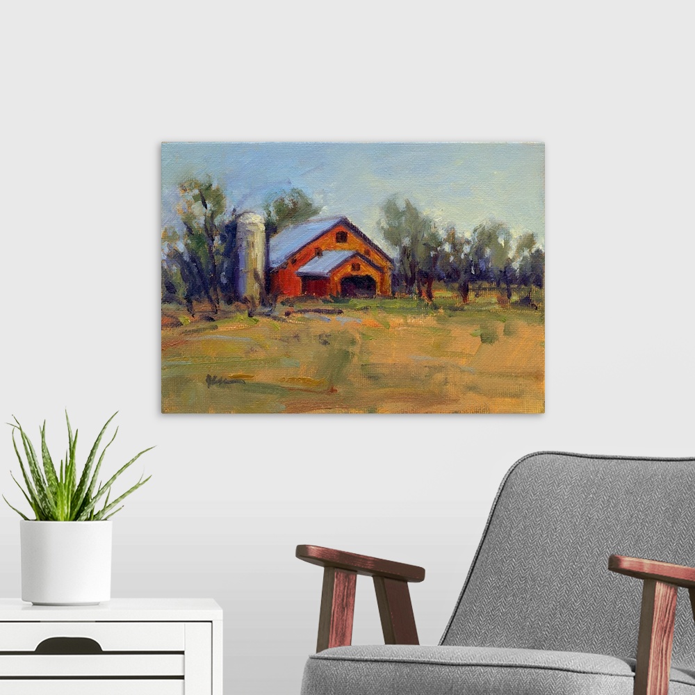 A modern room featuring A horizontal contemporary painting of a barn lined with trees in the afternoon light.