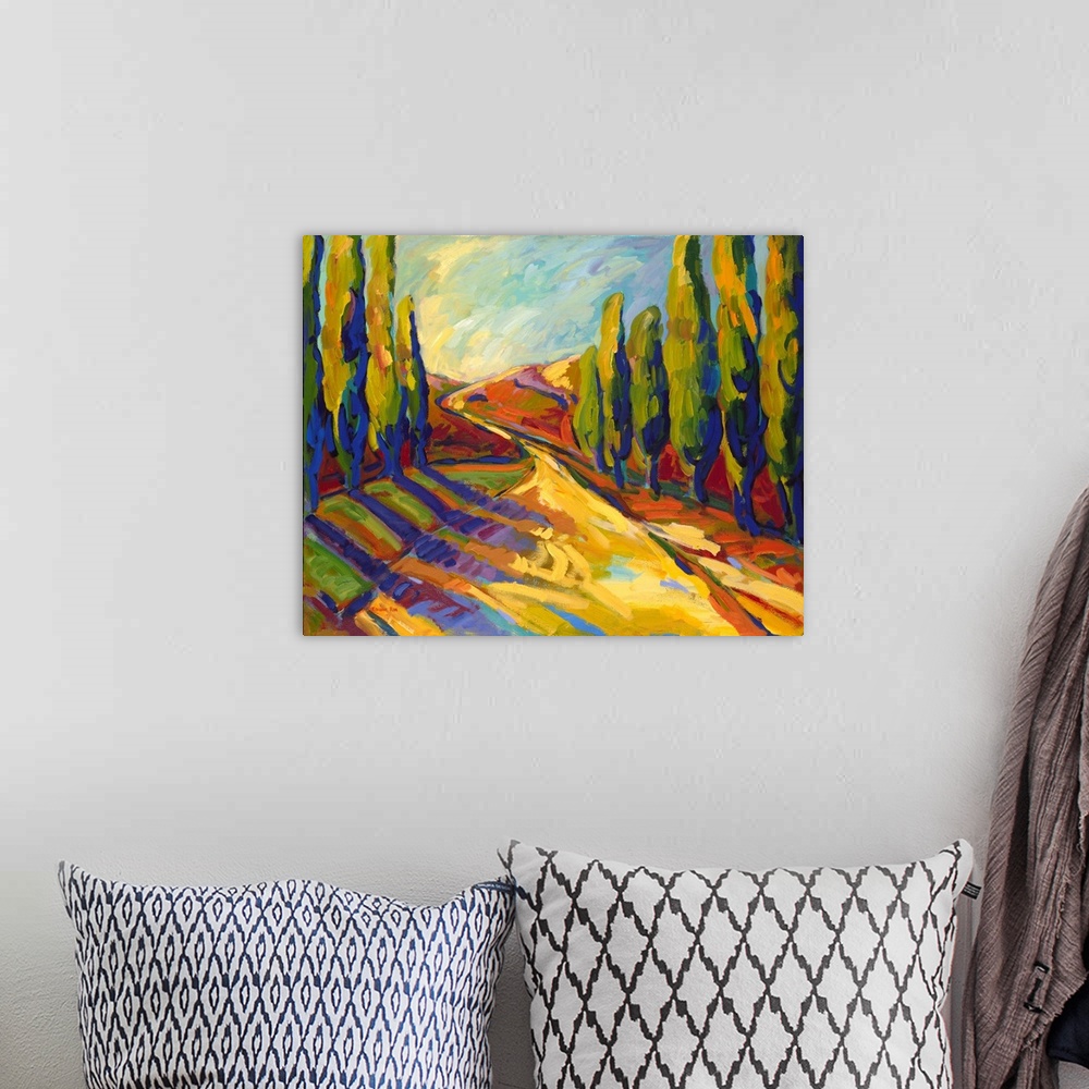 A bohemian room featuring A contemporary painting of a small country road framed by cypress trees.