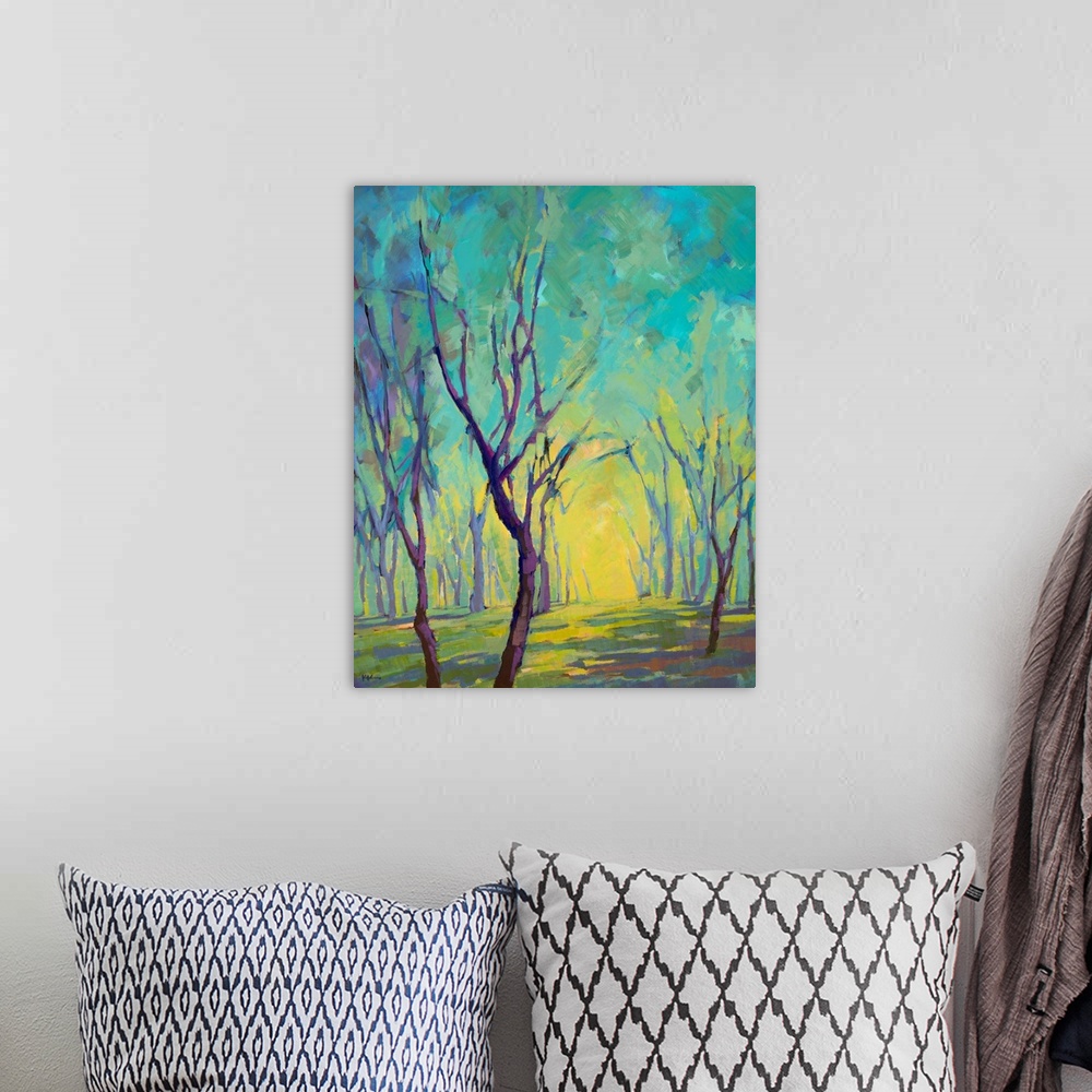 A bohemian room featuring Vertical painting of a forest in colors of blue, green and yellow.