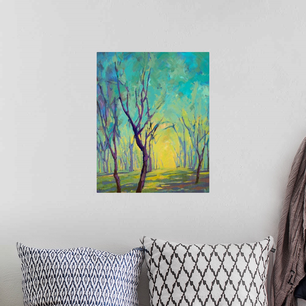A bohemian room featuring Vertical painting of a forest in colors of blue, green and yellow.