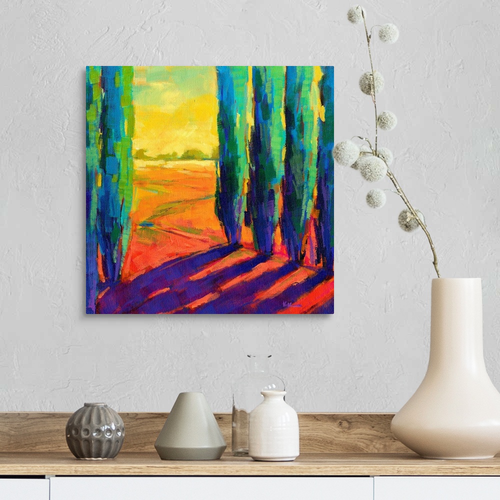 A farmhouse room featuring A contemporary painting of a small country road framed by cypress trees.