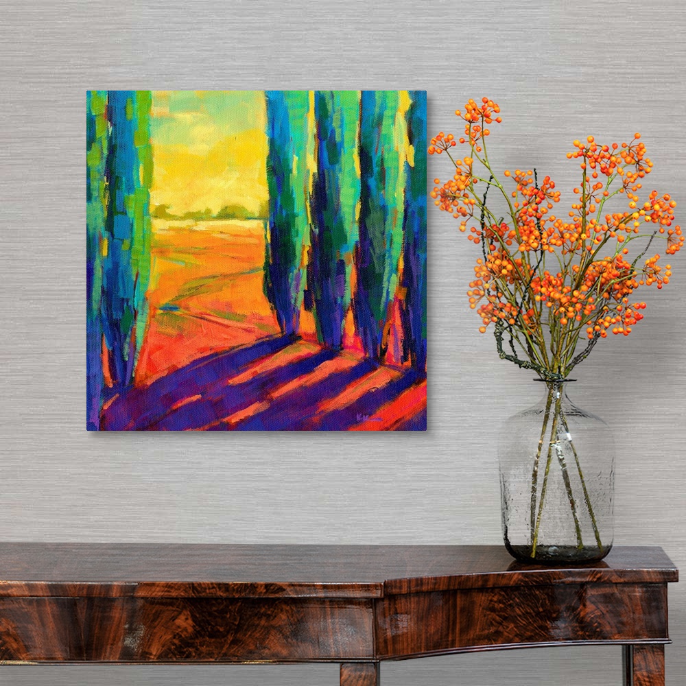 A traditional room featuring A contemporary painting of a small country road framed by cypress trees.