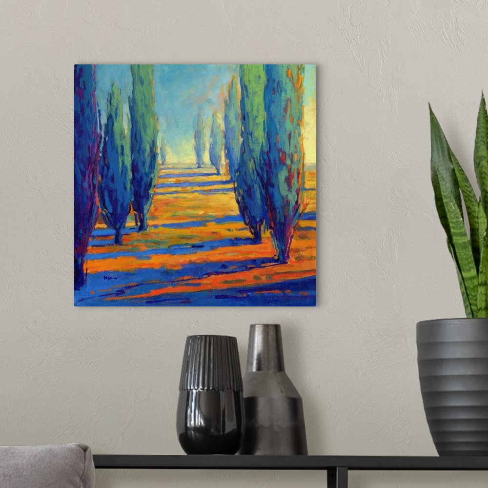 A modern room featuring A contemporary painting of a divide between a row of cypress trees.