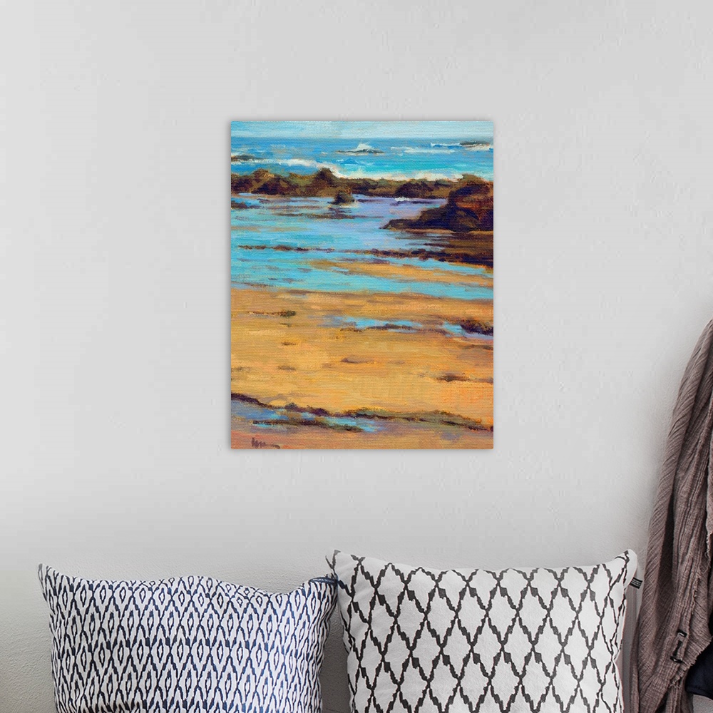 A bohemian room featuring Vertical contemporary painting of a rocky beach with vivid blue water.