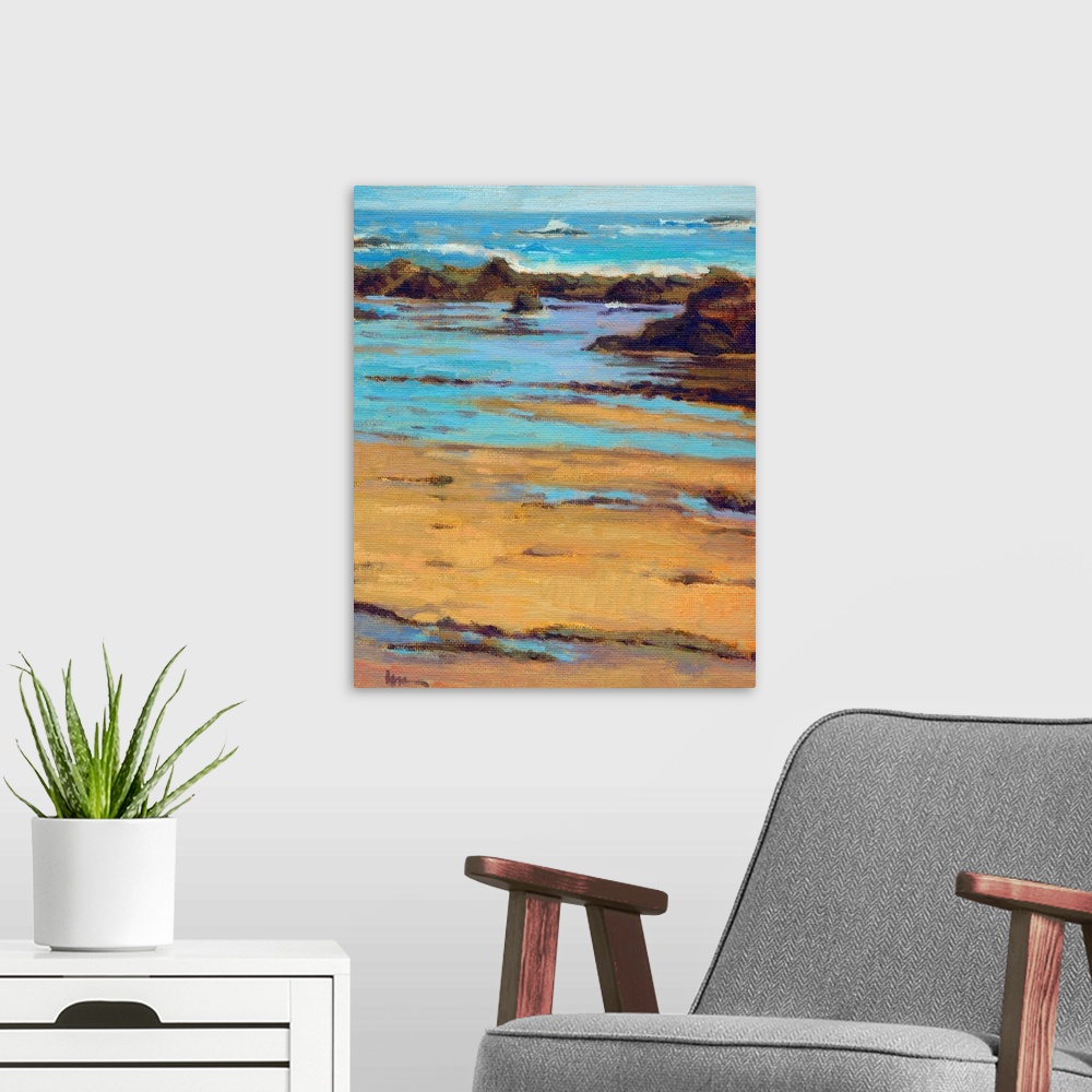 A modern room featuring Vertical contemporary painting of a rocky beach with vivid blue water.