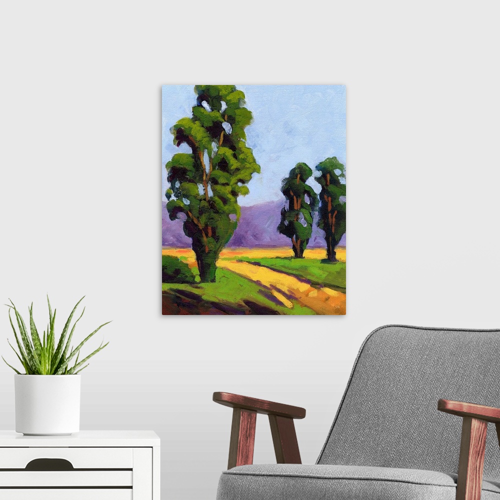 A modern room featuring A contemporary painting of a small country road framed by Eucalyptus  trees.