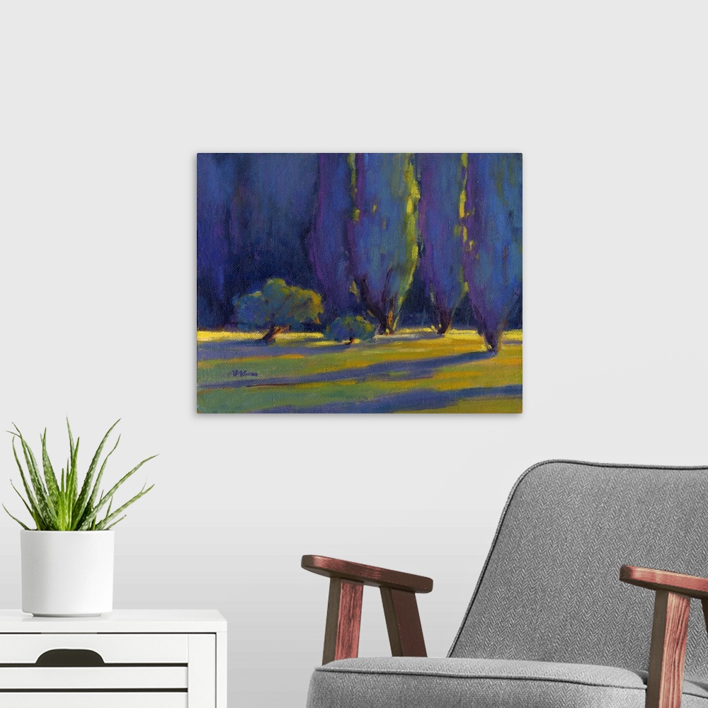 A modern room featuring Horizontal painting of a row of trees in shades of blue and green.