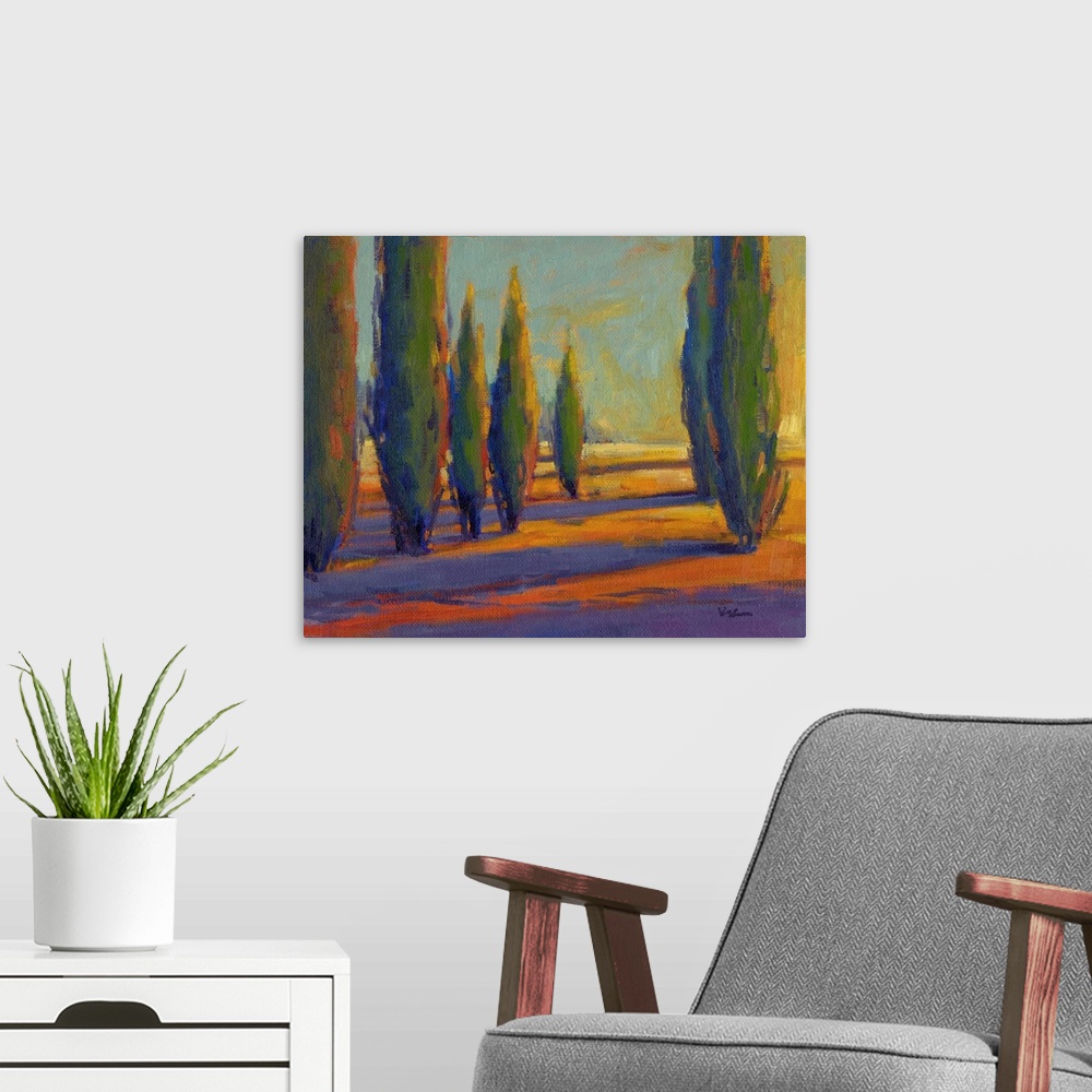 A modern room featuring A contemporary painting of a divide between a row of cypress trees in golden colors.