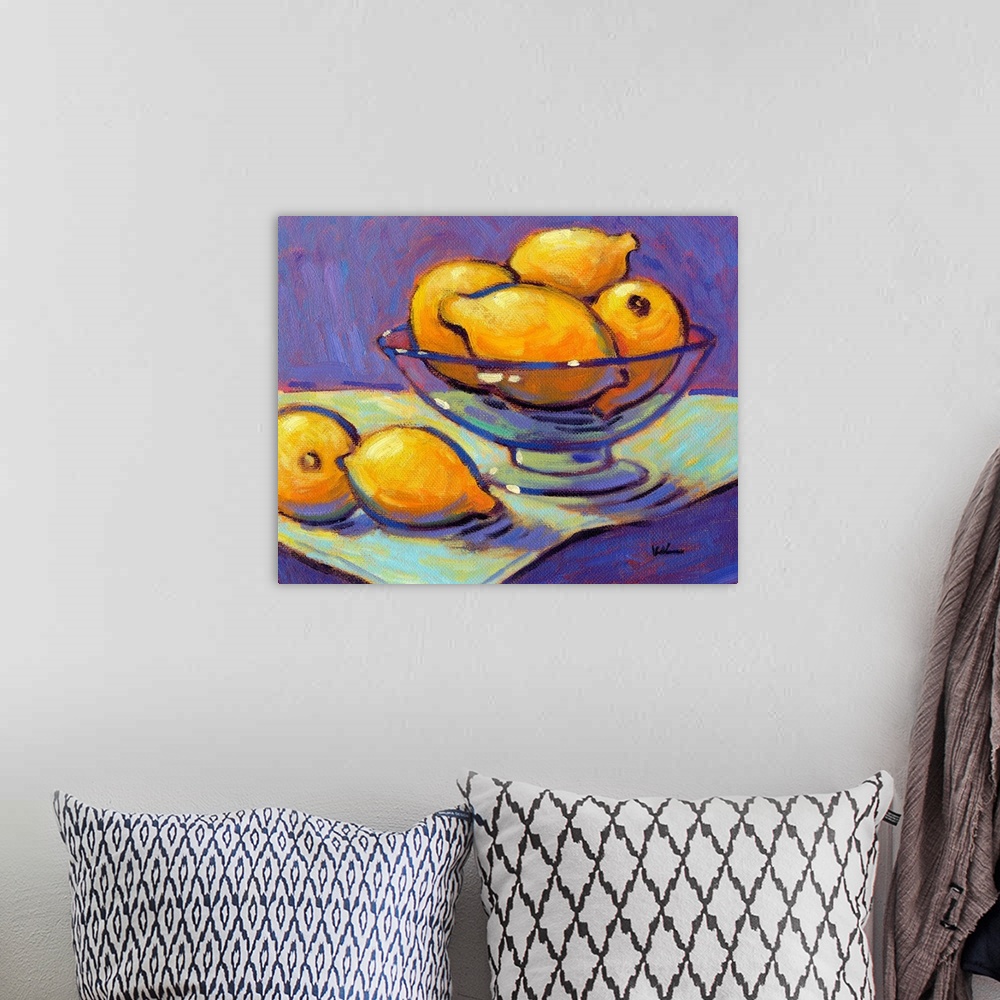 A bohemian room featuring A contemporary abstract painting of a bowl of lemons against a purple background.