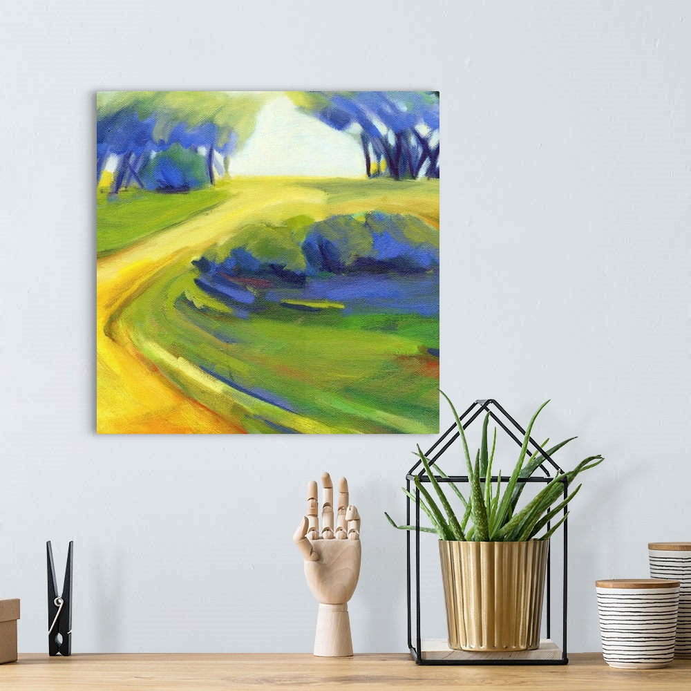 A bohemian room featuring A square painting of a winding road in the countryside.