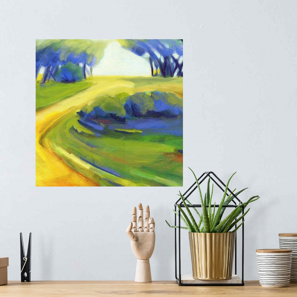 A bohemian room featuring A square painting of a winding road in the countryside.