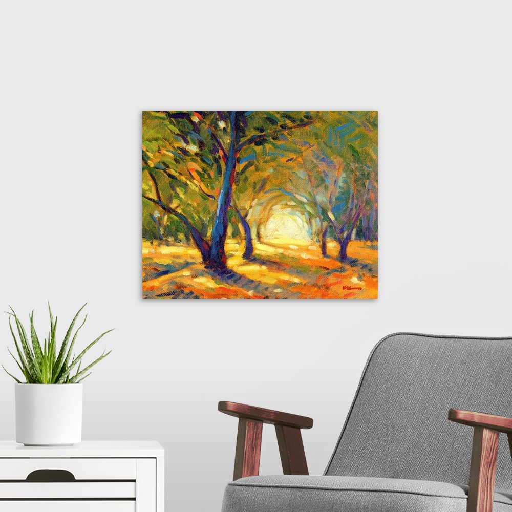 A modern room featuring A horizontal contemporary painting of colorful autumn forest.