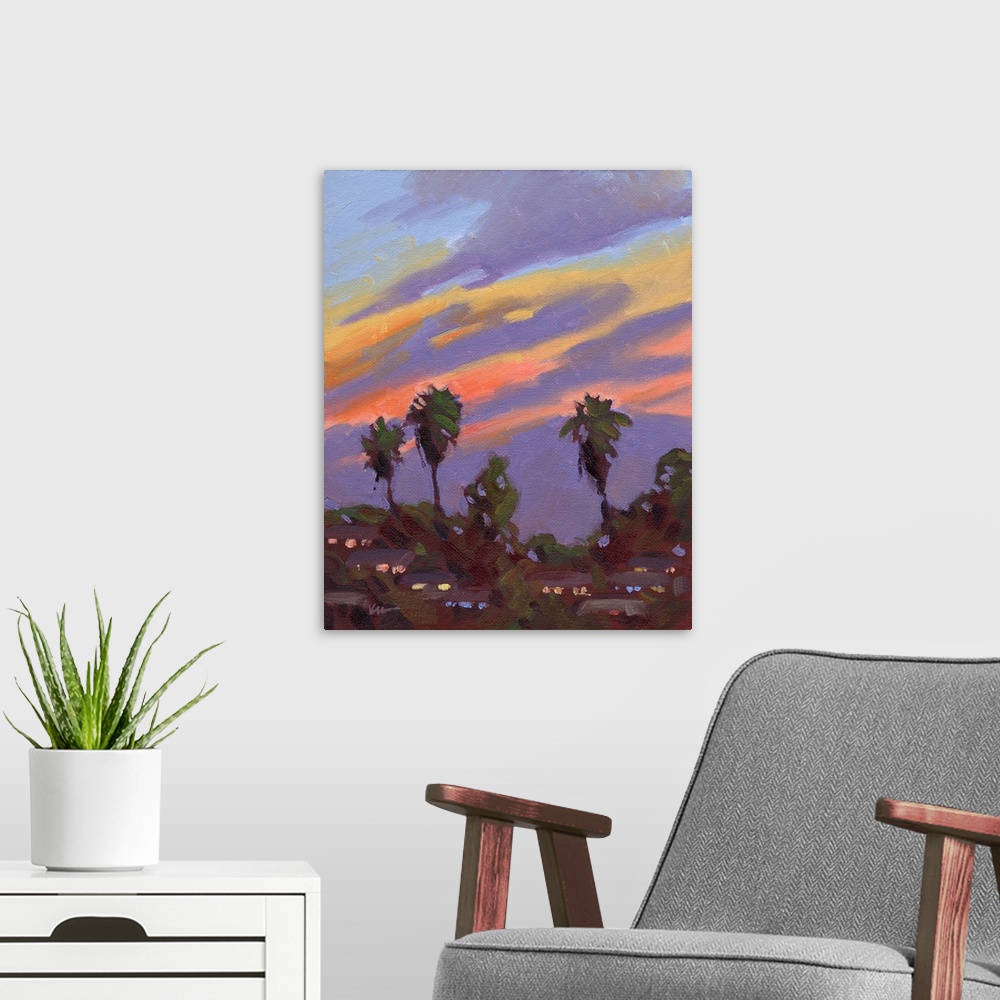 A modern room featuring A vertical painting of palm trees with a vibrant sunset.