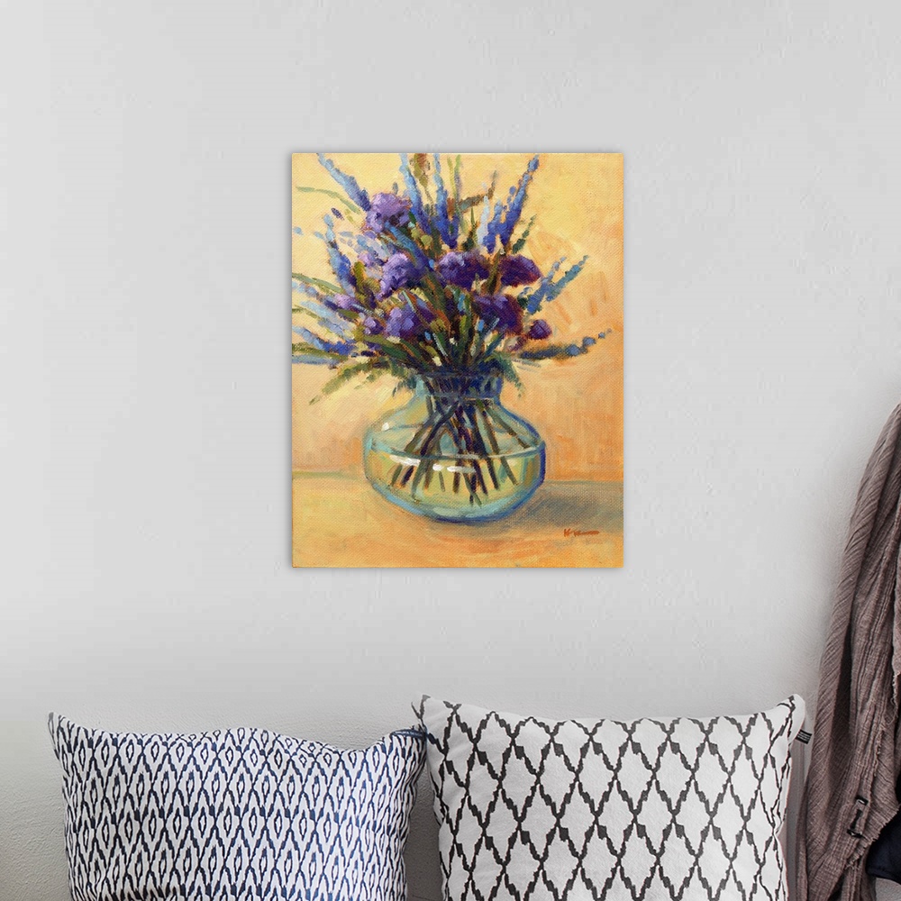 A bohemian room featuring A vertical contemporary painting of a glass vase of eloquent summer flowers.