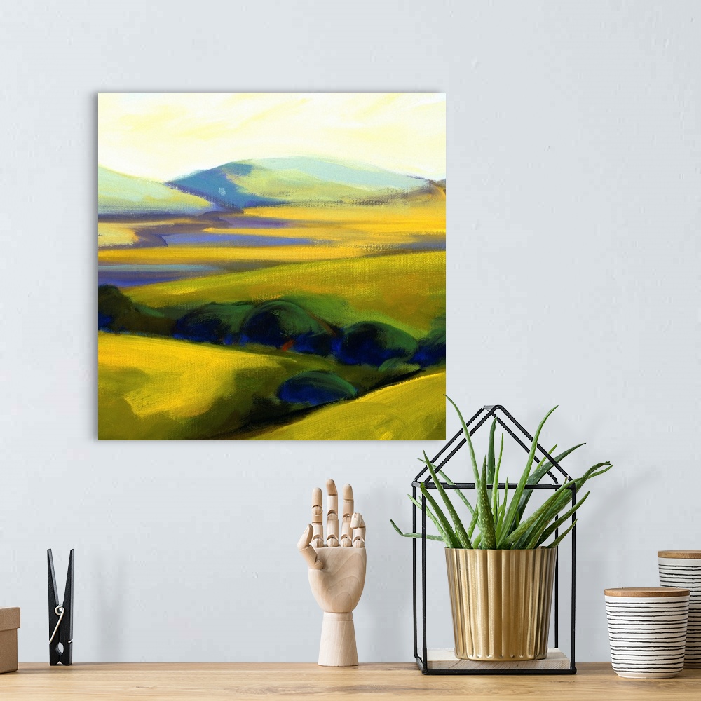A bohemian room featuring A contemporary painting of a row of trees and rolling hills.