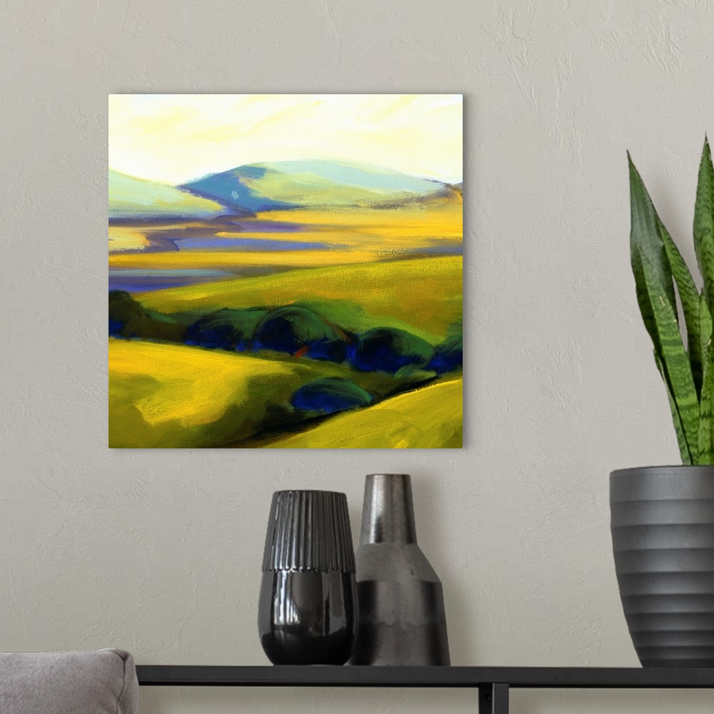 A modern room featuring A contemporary painting of a row of trees and rolling hills.
