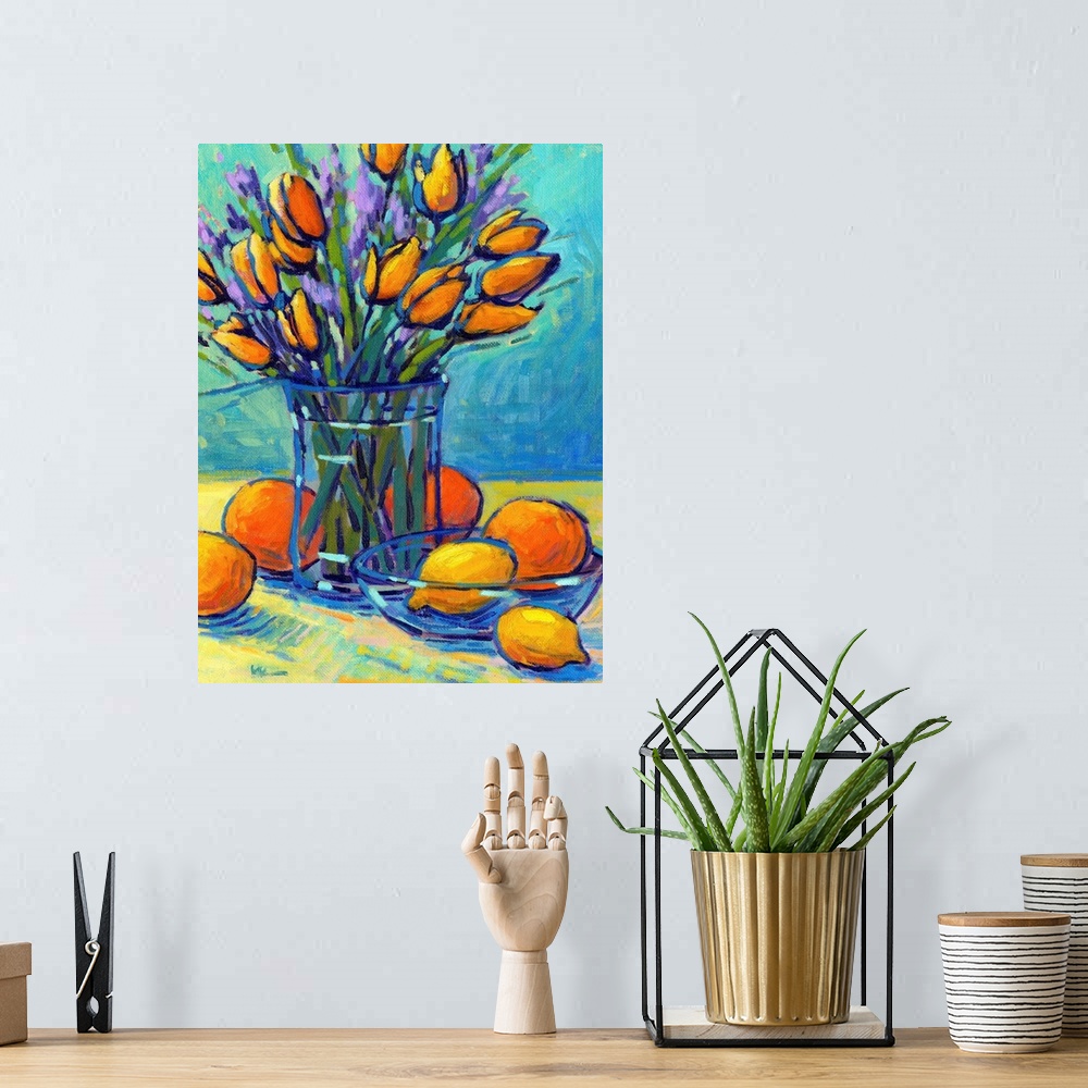A bohemian room featuring A vertical contemporary painting of a glass vase of tulips with oranges and lemons.