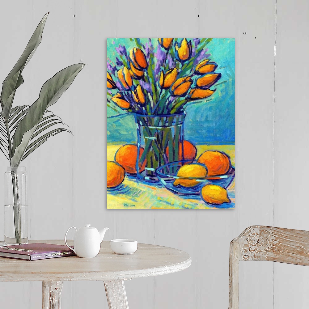 A farmhouse room featuring A vertical contemporary painting of a glass vase of tulips with oranges and lemons.