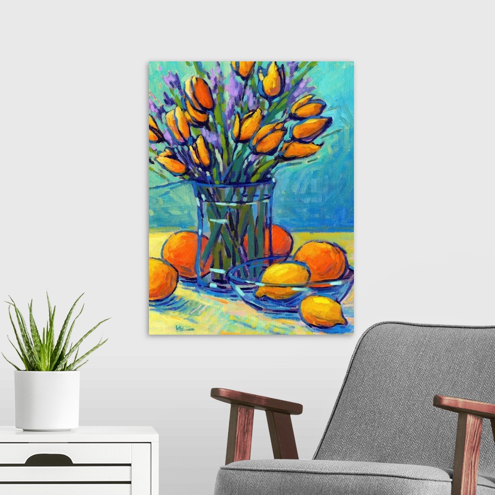 A modern room featuring A vertical contemporary painting of a glass vase of tulips with oranges and lemons.