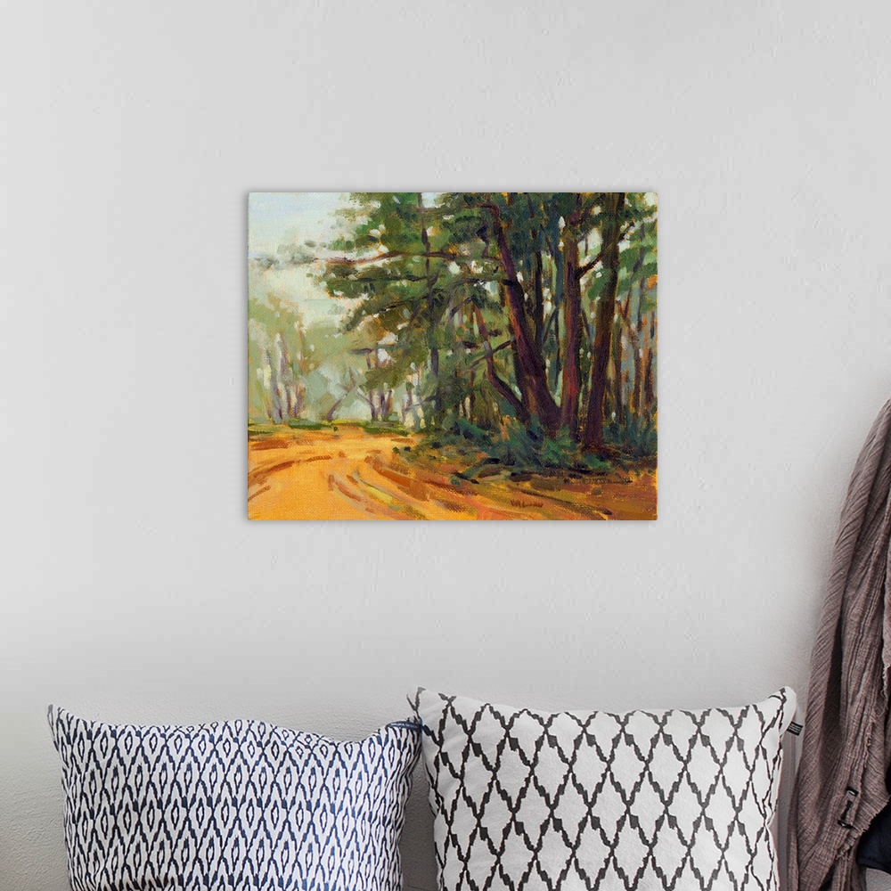 A bohemian room featuring A contemporary painting of a small country road framed by a forest.