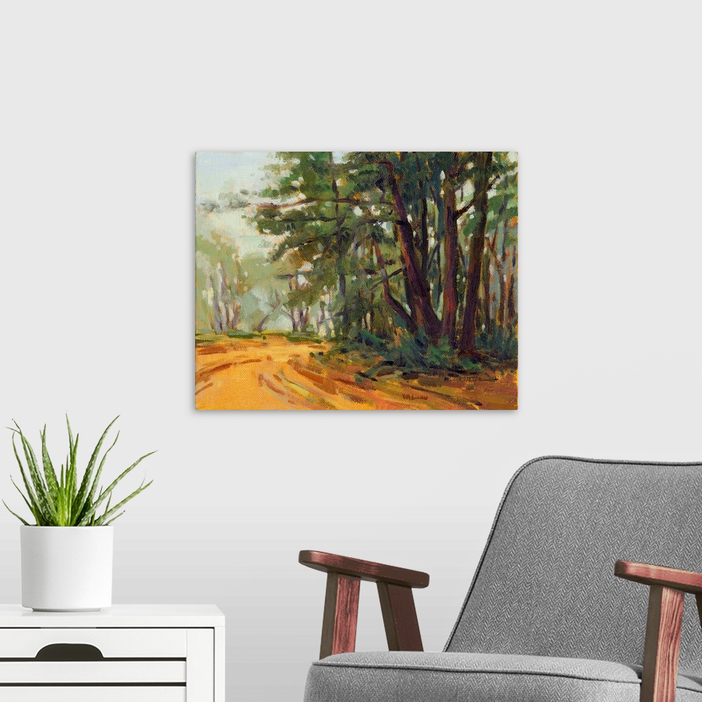 A modern room featuring A contemporary painting of a small country road framed by a forest.