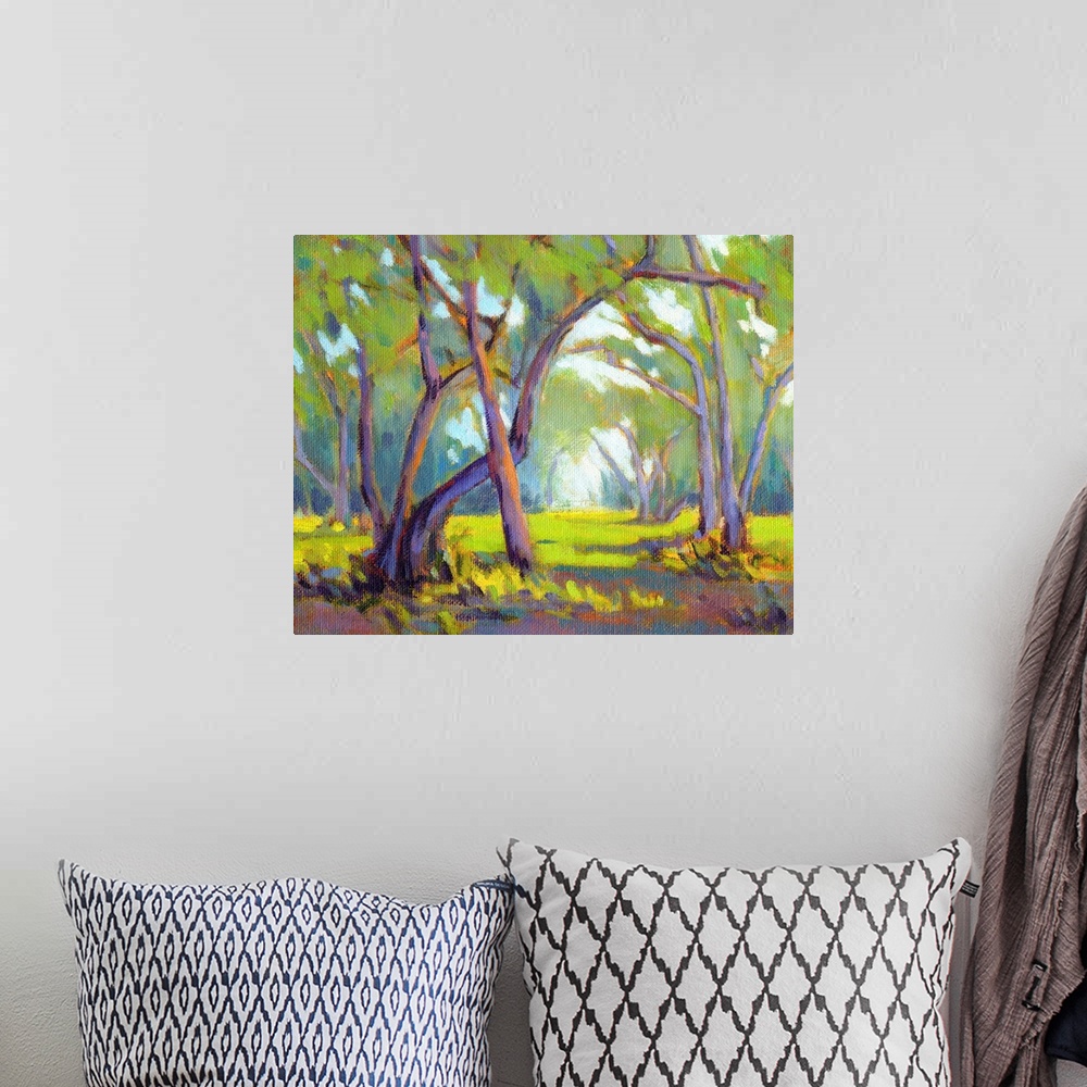 A bohemian room featuring A horizontal contemporary painting of  forest.
