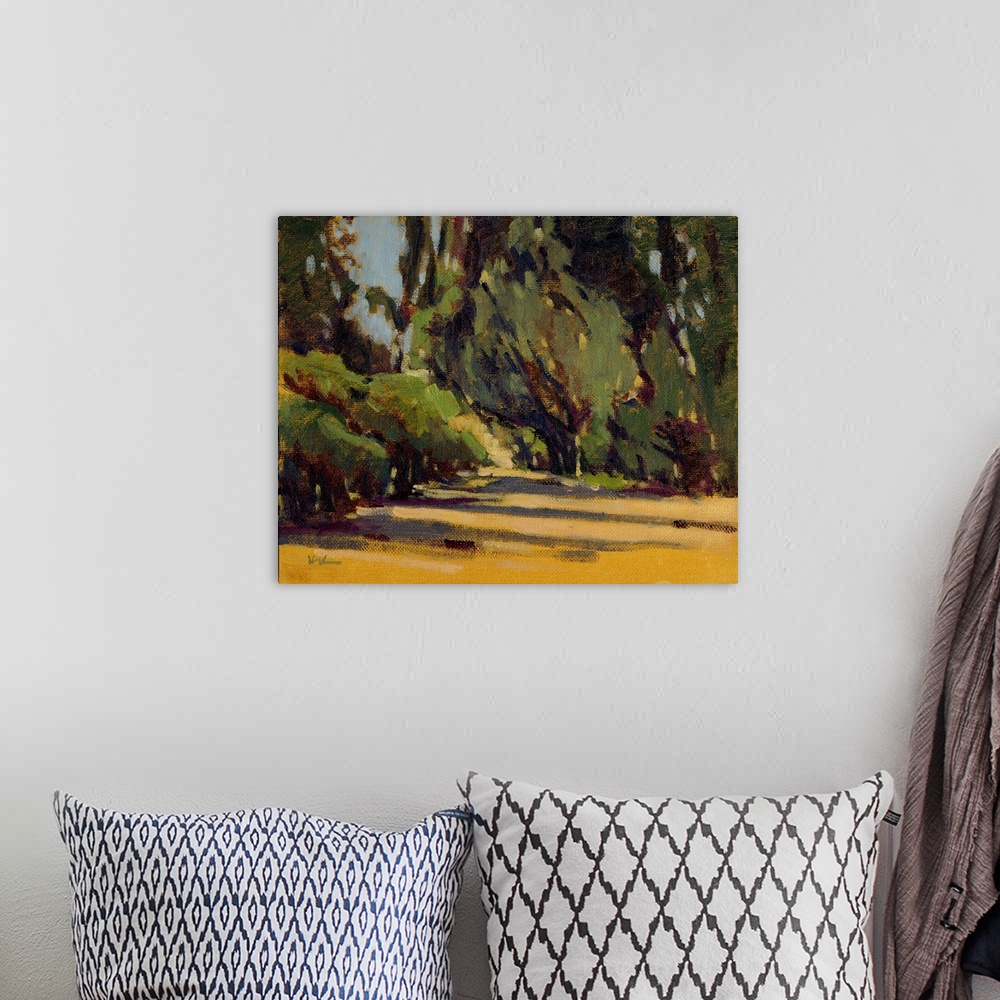 A bohemian room featuring A contemporary painting of a small divide in a forest.
