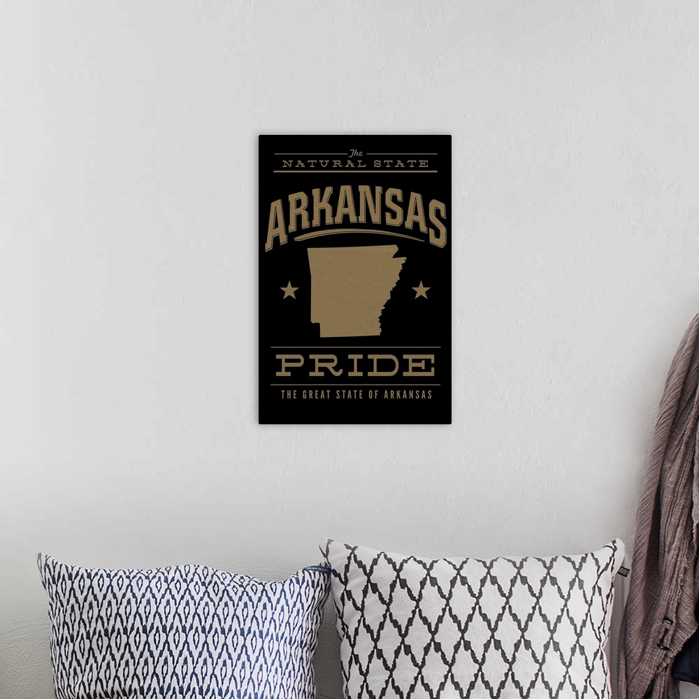 A bohemian room featuring The Arkansas state outline on black with gold text.