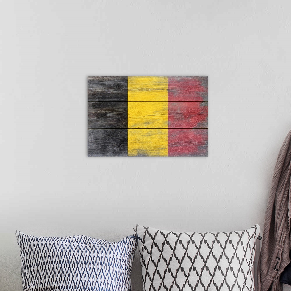 A bohemian room featuring The flag of Belgium with a weathered wooden board effect.