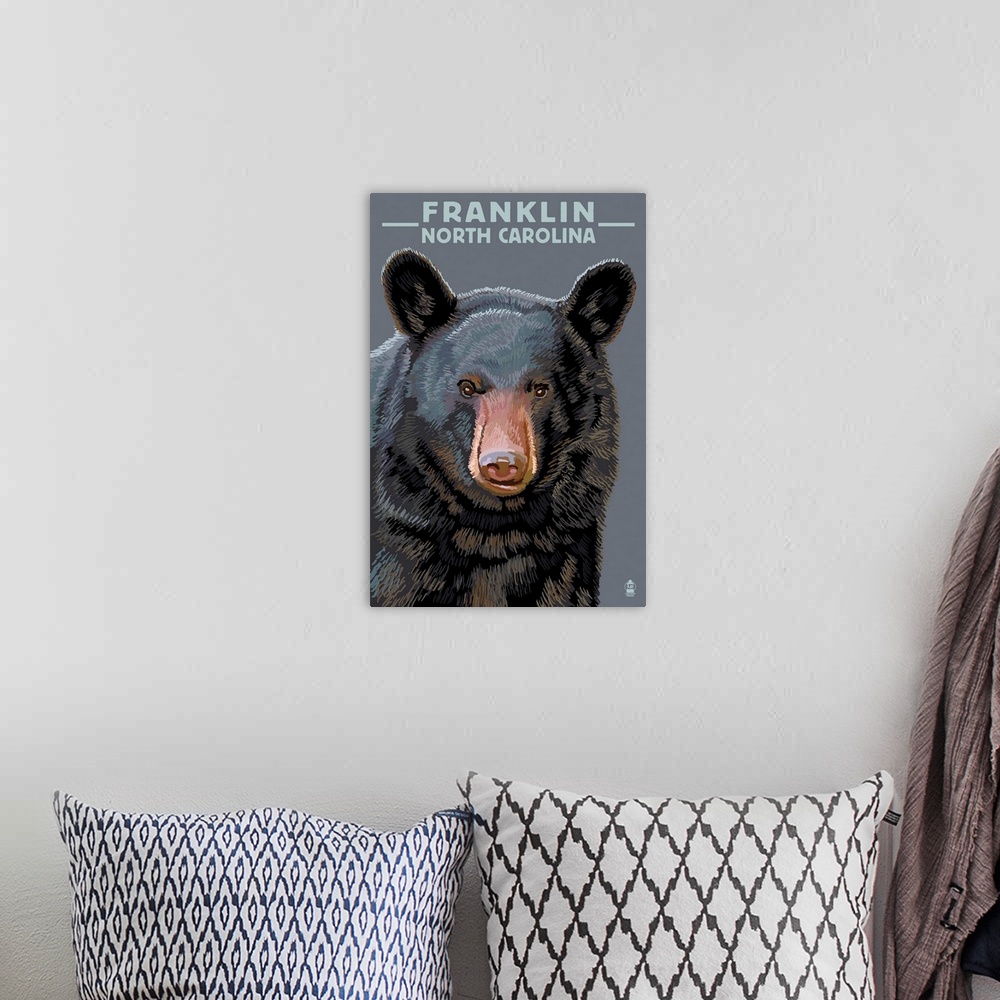 A bohemian room featuring Retro stylized art poster of an adult black bear's head and shoulders.