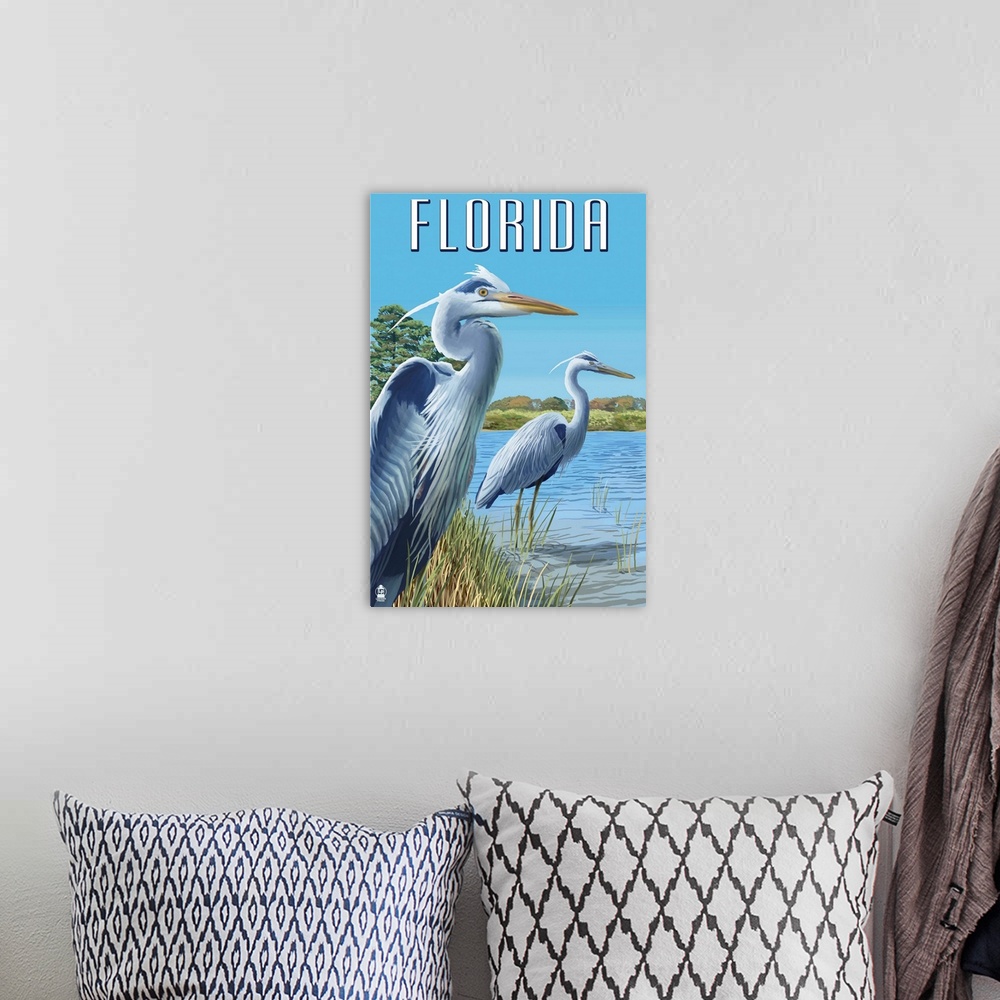 A bohemian room featuring Retro stylized art poster of two blue herons standing at the edge of a river.