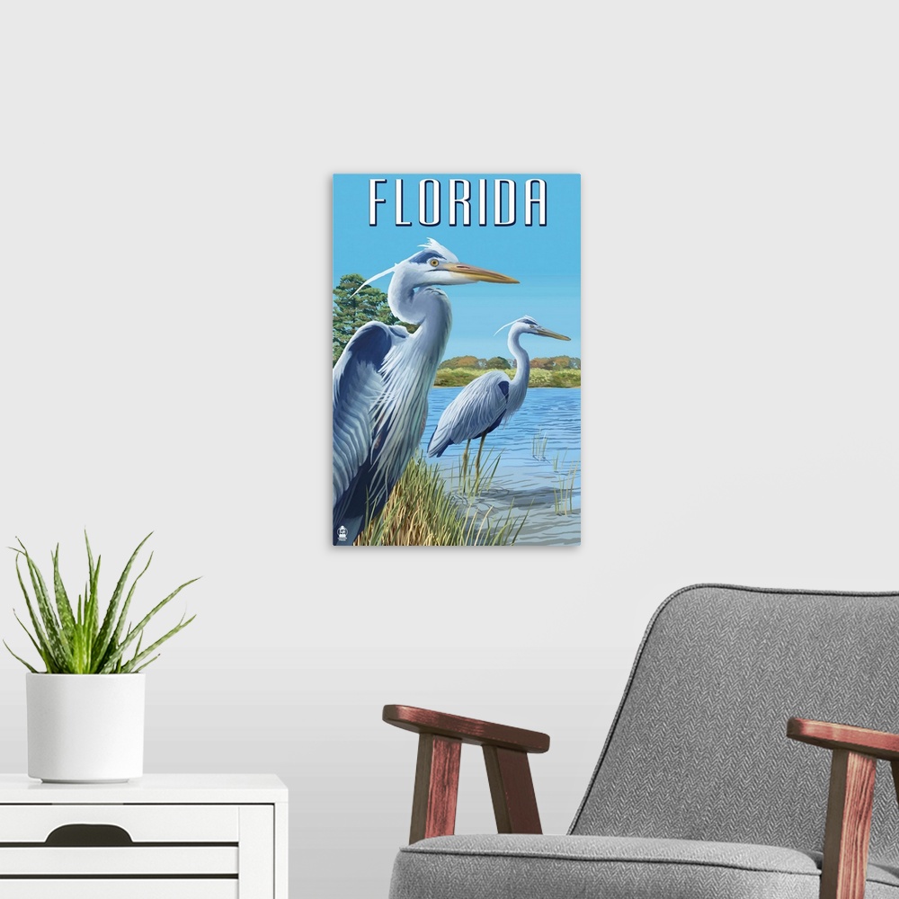 A modern room featuring Retro stylized art poster of two blue herons standing at the edge of a river.